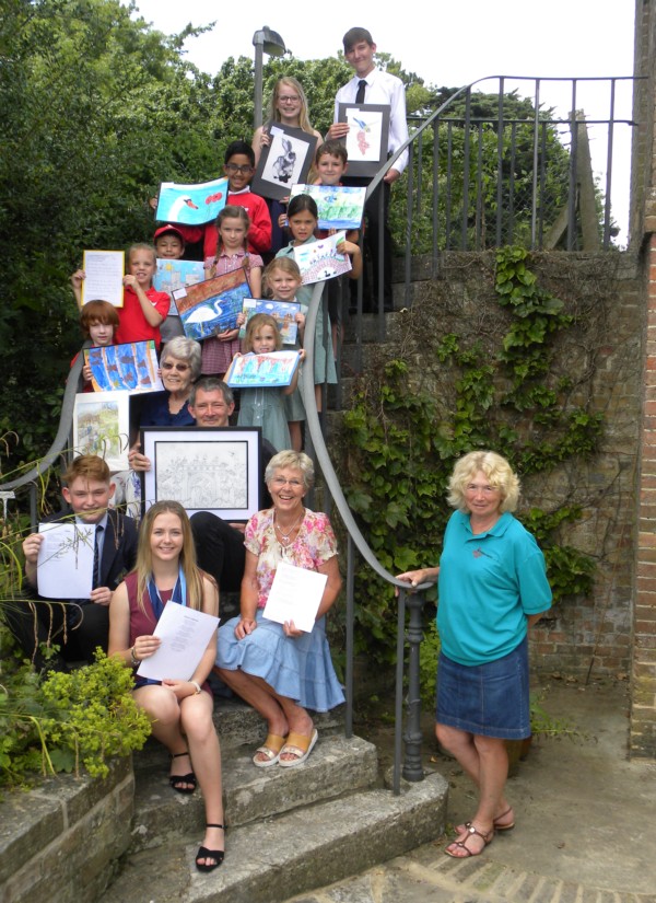 Photo of some of the Winners in both the Art and Poetry Competitions along with Susie Gatrell (front right) member of the Wimborne in Bloom Committee who co-ordinated the competition on behalf of the Committee